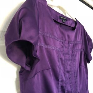 Crew neck, silk-like top with lace detail